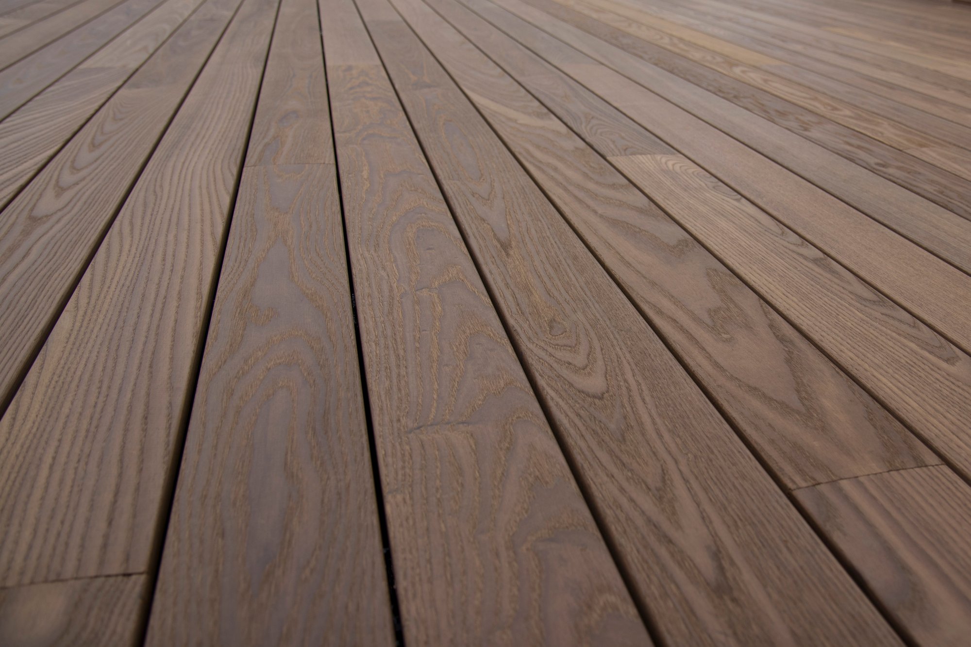 perfectly aligned dark wood decking boards